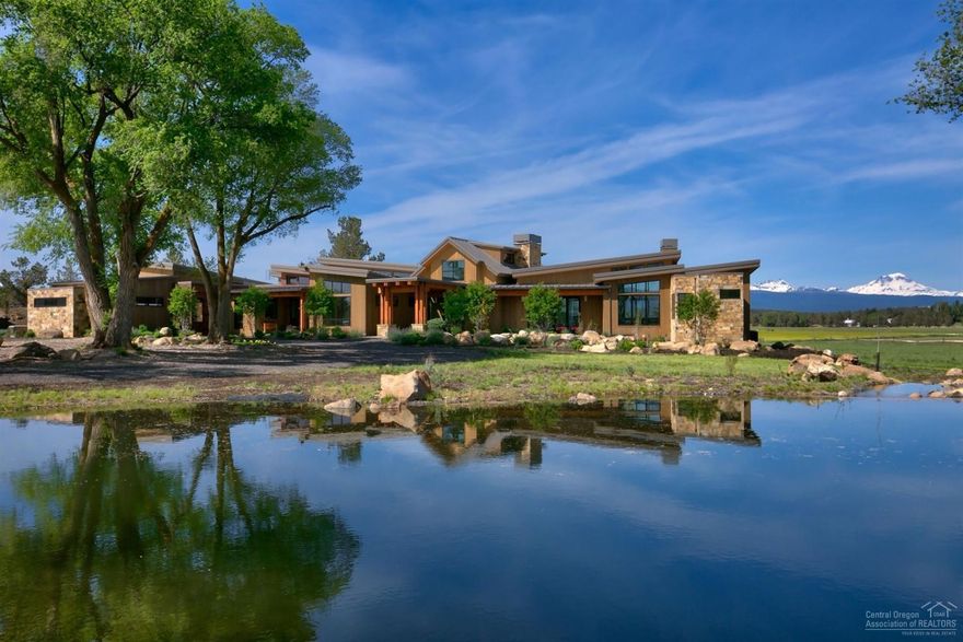 Six Bit Ranch is 38 acres with 35.1 acres of water rights with pivot, automatic sprinkler systems, pond, water feature. Stunning Contemporary Home designed with warmth, wood finishes, natural light oriented to capture the Cascade Mountain Views. Home Features: 4036 sf 3 bed, 3.5 bath single level, gourmet kitchen, master suite, attached guest suite, office, open floor plan ideal for entertaining, patios, attached 3 car garage, barn, equipment shed, landscaped and passive solar design. See virtual tour.