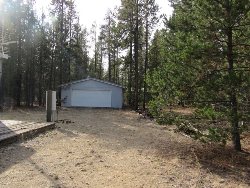 Located in the community of Deschutes River Recreation homesites  are 2 tax lots being sold as 1.  15702 is being sold with this home to create a 2 acre parcel. It has a Garage without electric.. Well maintained, cute Marlette, 2 bed, 2 bath home was a model home on a lot &  til moved from lot to the property.  There has never been a full time resident in the home.  It has been used as a vacation home.  Home can be sold with the furnishings.  Lots of trees help to make this lot private. Close to the State Park, River and BLM.