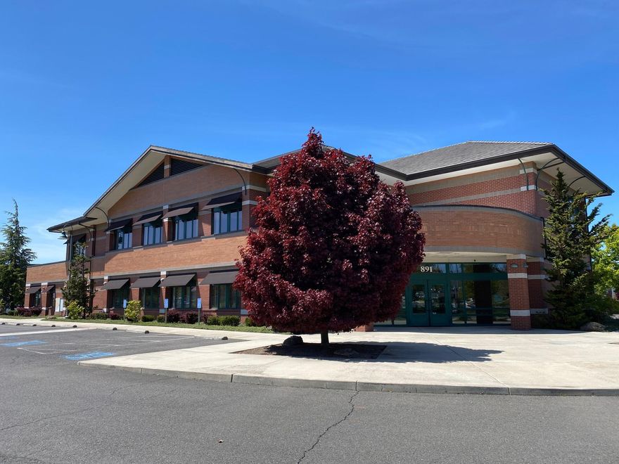 ''Price Reduced''  High profile office building in excellent condition!  Approximately 14,254 SF 2-story building on 1.93 acres built in 2003.  The ground floor totals approx. 8,306 SF, and the second floor (is serviced by an elevator) is approx. 5,948 SF.  The building is steel frame construction with brick masonry exterior.  The exterior and interior of the building is in excellent condition and has been well cared for.  The property is located within the Navigator's Landing commercial division and is zoned Light Industrial (I-L) with a planned unit development (PUD) overlay.  There are 56 designated parking spaces on site.  The property is located adjacent to the Rogue Valley International Airport.  Former bank branch location with a combination of nice private offices and open areas.  Drive-thru lanes on the North side of building.  

Property to be sold with a deed restriction in place against use by a financial institution for 5 years from closing.