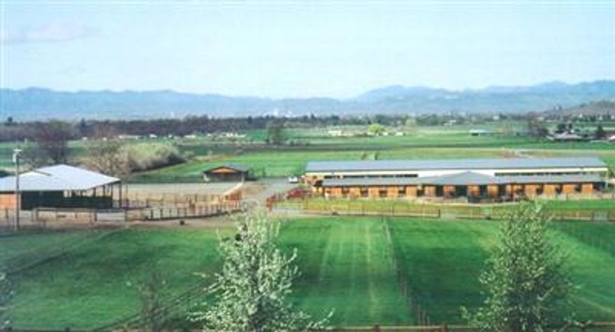 MAJOR PRICE REDUCTION! A state of the art facility for the serious trainer, breeder and rider. As beautiful as it is functional. Gorgeous 122 acres w/ 64+ irrig acres.Professionally designed horse facility, large covered indoor & outdoor arenas, paddocks for all shedrow stalls, heated tack-up & wash rack barn w/ kitchen, bath, laundry & vacuum sys. Separate vet facility & foaling stalls, hay barn, shop/equip hangar, cross-fenced pastures, 2 round pens. Beautiful landscaping, gardens & fencing. Includes 2 great ranch homes w/views and a 3rd view homesite on splittable acreage. Check out MLS #2906279.