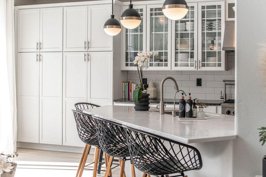 Step through the front door of this home and into your interior designer's dream! This home checks all of your boxes: Master on main, large corner lot, 3-car garage, & bonus room! Designer updates throughout include wide plank white oak wood floors, a custom master bathroom, shiplap powder room, reclaimed wood accent dining room wall, laundry room with utility sink & built-in storage, marble tile fireplace surround w/ reclaimed wood mantle and designer light fixtures throughout. The spacious kitchen features white quartz & Nordic Black granite counters w/ full subway tile backsplash, stainless appliances, white cabinets, pot-filler & glass upper cabinet doors. In addition to the 4 bedrooms, this stunningly updated home features a large loft, bonus room, formal living and dining room AND open great room! The newly hardscaped backyard is an entertainer's dream, with extensive paver patios areas, automated lighting, gas for fire pit and electrical for hot tub! Don't miss this one!