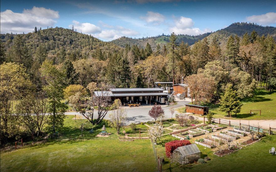 Vineyard, Winery, Creamery, Charcuterie and Vacation Rentals in the beautiful Applegate Valley AVA of South Central Oregon - Established in 1978 will convey turnkey! Equipment, furnishings and all the secrets of wine, cheese and charcuterie making will convey with this beautiful property. 23 deeded and 46 leased acres planted with 12 varietals. Cream and meat are sourced from local farms and processed on the property. Five Winery/Creamery buildings, including a lush tasting room with outdoor seating and picnic area, plus a 2bdr/2ba log home and Studio above a 3-car garage. The Winery has a Capacity of 31,500 Cases. Current Production is 5,000 Cases + Keg & Bulk Wine. A hoist and hopper system is in place to allow for the transition from hand to mechanical harvesting. The white barn has office space, event space, stalls for livestock. The second floor is plumbed for a kitchen, while the main floor serves as a feed room with lockers, laundry and bathroom. Come and take a look!