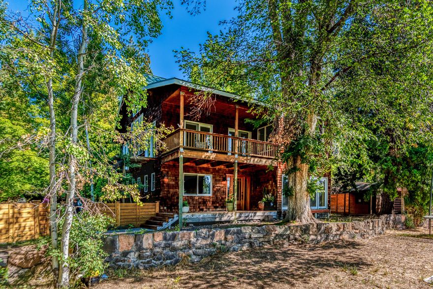 Location, location, location! This stunning 3 bedroom, 3 bathroom,3419 SF home is nestled in one of
Central Oregon's most desirable locations! Down the street from Riley Ranch Reserve, approx. 1 mile to Sawyer Park and the Deschutes River trail system and under 4 miles to downtown Bend is home was built with entertaining in
mind ! Pass through this open living room with huge windows and stone fireplace, fabulous chefs kitchen, huge island, coffee bar, all lead out to a wonderful deck tucked in the tree tops! Bath vanities and floors in master are reclaimed CVG fir from Dairy Barn in 
Tillamook. The wet bar/pantry also has a wine refrigerator included in sale. Outside there is a detached two story garage with double garage doors and a wonderful work shop. Upstairs is a very large Studio/Bunk house that is full of possibilities. Additional storage shed and area for RV parking too!!  This is not a drive by!