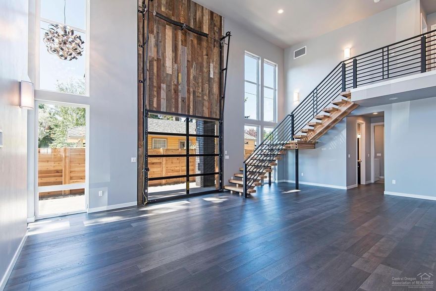 Stunning new construction by Evolve Building & Dev featuring modern open-concept layout,expansive windows w/glass garage door opening up to the outdoor liv area w/ firepit. 561 sf 1/1 ADU w/& alley access. Main home is 1,950+ sf w/main lev mastr, solid surface counters, custom cabinetry & designer lighting, SS steel appliances & expansive hardwood floors. Shopping, dining & parks are nearby in this quiet downtown Bend location.Call/txt today for more information about this exciting new home!