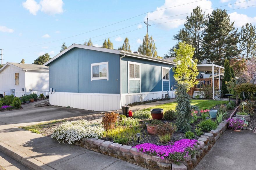 Nestled in San George Estates, this meticulously updated 2002 manufactured home exudes modern comfort and style. Its open floor plan, vaulted ceilings, and laminate flooring create an inviting ambiance. The well-appointed kitchen with ample cabinetry and a convenient breakfast bar seamlessly connects to the laundry area, expansive living room, and dining space. The primary bedroom offers a spacious closet and an updated bathroom with a sleek vanity and shower. Additionally, the second bathroom features new vanity and flooring installations, enhancing its appeal. Enjoy relaxation on the covered side porch amidst the beautifully landscaped front yard. This home is ready to welcome its new owner with open arms.