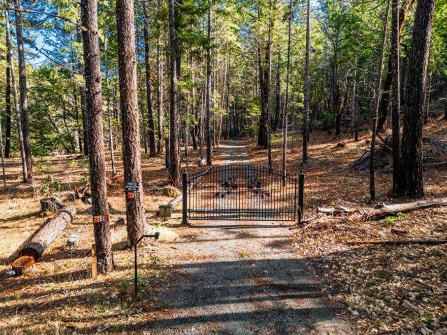 Owner CARRY at NEW Price! -Are you looking for a private parcel with previously approved homesite? Extra privacy with BLM land behind? This beautiful 40 acres has almost 2+ level acres nestled inside sloped, treed acreage.   Original Homesite, while requiring new application, has already had tractor work/grading  prep work., and was previously approved with well and septic sites determined in past as well. Bonus is that there is a gated entrance that you and your neighbor share to maintain privacy.  Elevated site without steep access offers you privacy and views! Love the beach? This location is en-route! How about River recreation? Or Lake Selmac just down the road. Also down the road, along with city amenities, is additional recreation and access to larger city amenities.  This price will help you obtain your new home dream! All offers considered