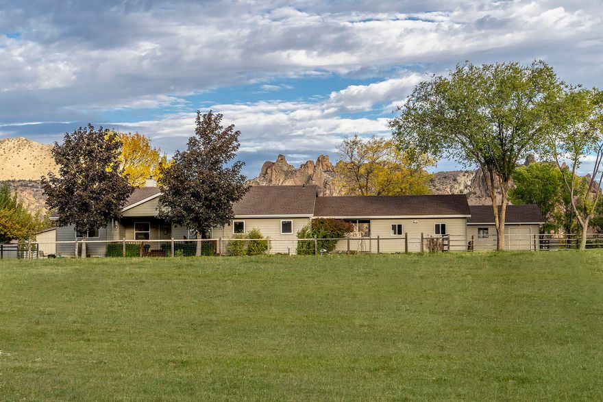 Wow! Stunning Smith Rock views from this lovely home on 5.24 ac with 3.8 ac of flood irrigation! Tucked away at the end of a quiet cul-de-sac, you'll find pride of ownership everywhere you look! The home has TONS of storage, a huge kitchen, 3 large bedrooms (1 currently used as an office, just needs closet doors) plus 2 baths. The family room was originally used as a 4th bedroom with a wardrobe in it. There are lots of updates including a ductless heat pump, newer pellet stove, siding & much more! There's a covered front porch, a nice deck & a 2-car garage which is attached to the home by a breezeway. Anywhere you sit you can watch the shifting light dance over Smith Rock. The shop is 576 sqft, the equipment building is 846 sqft & could be converted into a barn for your critters, it has RV hookups, is fenced & cross fenced, has irrigated pastures plus several garden beds too. There's so much more to see with this beautiful property so make your appointment today!