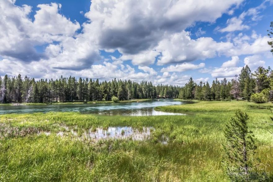 Outstanding single-level home with an open great room design, large rear deck with panoramic Deschutes River views, and large back yard leading to the water's edge Located in Sunriver's quiet north end and close to the Woodland Golf Course and owner's North Pool. This well-maintained home has a large kitchen and two spacious master suites. Large windows in the great room, dining room, and kitchen bring in the Central Oregon sun and allow memorizing views of the river. Four bedrooms, three full baths, and a half bath. Some of the additional features include storage over the garage, built in safe, two furnaces, and cedar walk-in closet in the master suite. Recently updated surfaces and furnishings. Welcome home!