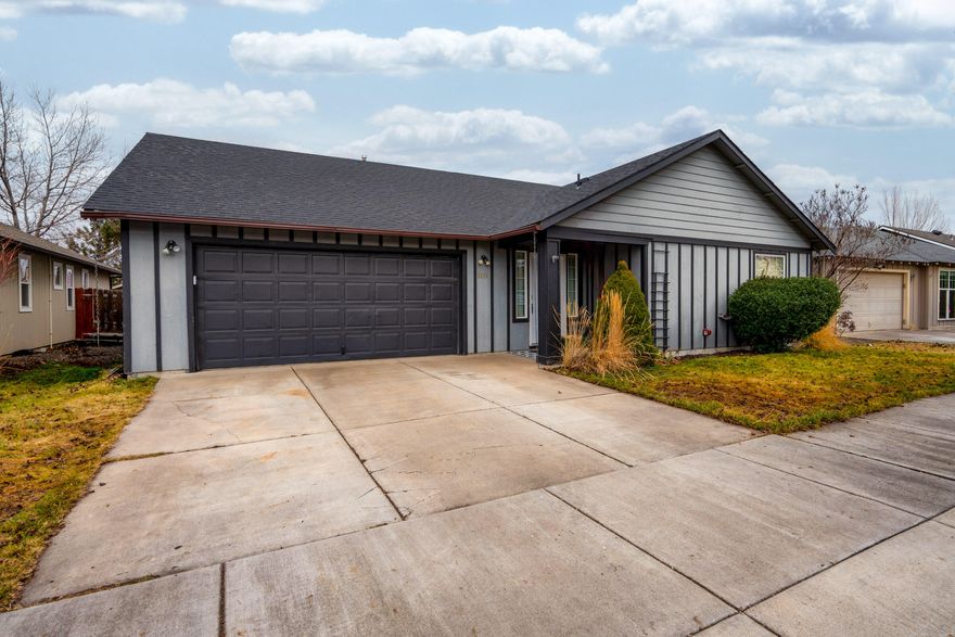Discover single-level living at its finest. Superb floor plan invites you by a welcoming entry unfolding into an open living space framed by vaulted ceilings and cozy gas fireplace. Rich hickory wood floors flow elegantly throughout, enhancing its charm and character. The kitchen space is a perfect blend of functionality and style, featuring ss appliances, tile countertops and eat bar creating a seamless connection w/dining room. Providing comfort and versatility w/its four bedrooms and two full bathrooms. Sizable primary bedroom w/en-suite bathroom that includes double-sink vanity and walk-in closet.  Exquisite $45K  backyard renovation designed for ease of living and year-round outdoor enjoyment featuring new landscaping w/low maintenance artificial turf, paver patio, gas firepit and deck. Nestled in a tranquil, friendly neighborhood, this home promises a balanced lifestyle being just moments away to all the amenities and natural beauty of Central Oregon has to offer.