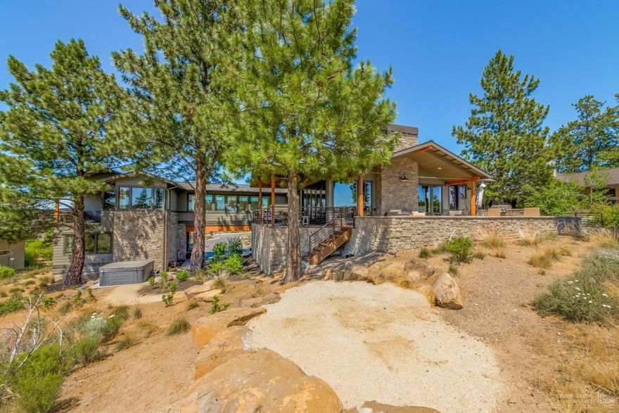 This captivating custom Bend Trend home in Tetherow pairs unparalleled quality with golf course, Cascade Mountain, and water views. Accordion glass doors in the great room lead to expansive outdoor entertaining spaces with built-in BBQ, heaters, and fire pit. The kitchen features a butler's pantry with Miele expresso maker, grand center island, farmhouse sink, and custom appliance panels. Master suite boasts fireplace, steam shower and private view patio. 4 car garage with epoxy and enviable storage spaces.