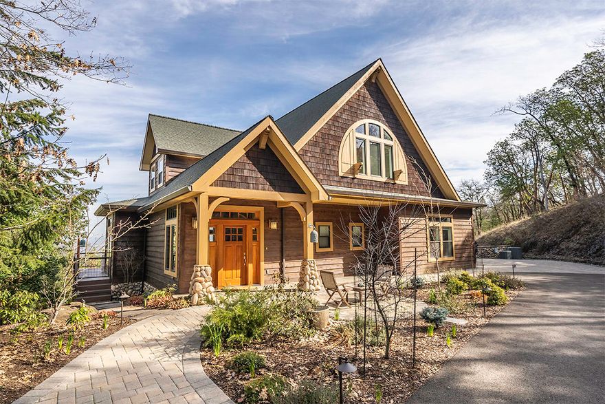 Majestic Craftsman style home with gorgeous valley views, nestled in the hills of Historic Jacksonville! Positioned on a 1.27-acre corner lot, this 4645 sq ft home offers the utmost privacy & seclusion just steps away from downtown shopping, Britt, local wineries & more. 3 bedrooms, 2 w/ensuites, spacious dining area, family room w/TV nook & wet bar, plus a bonus area perfect for an office, gym, or 4th bedroom. Entertainer's dream home w/an open floor plan, large windows & transoms, & an expansive deck overlooking the valley. Professionally designed island kitchen w/eating bar, serving area, walk-in pantry, large farm sink, & luxury appliances. Gas fireplace, pine floors, Craftsman style trim, & a laundry/mud room w/built-in cabinetry. Spacious, vaulted master suite w/a private deck, gas fireplace, & spa-like ensuite. Two, oversized 2-car garages, walking paths, extensive yard lighting, deer fenced garden area, fire pit, greenhouse, asphalted driveway, & plenty of room for RV parking.