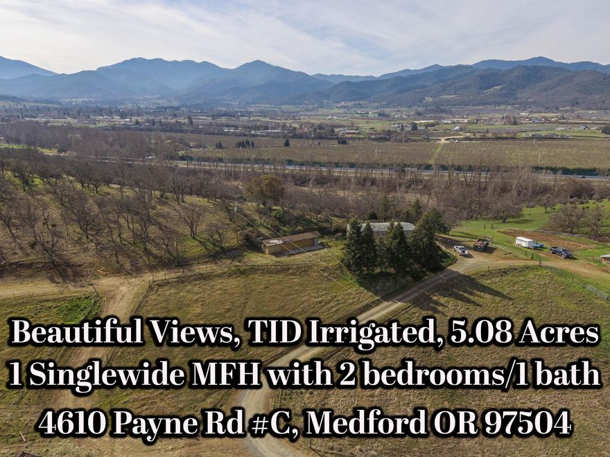 County life on 5.08 acres with gorgeous sweeping views! Build your own or keep the older 2 bedroom/1 bath manufactured home. Property is fenced and crossed fenced, all on prestigious Payne Road! Includes TID Irrigation. Property is EFU zoned and could be used for Hemp, Vines, animals and more! Adjacent 4.92 acres listed for sale at $280K has older 3 bedroom/2 bath manufactured home and must close simultaneously with this 5.08 acre property.