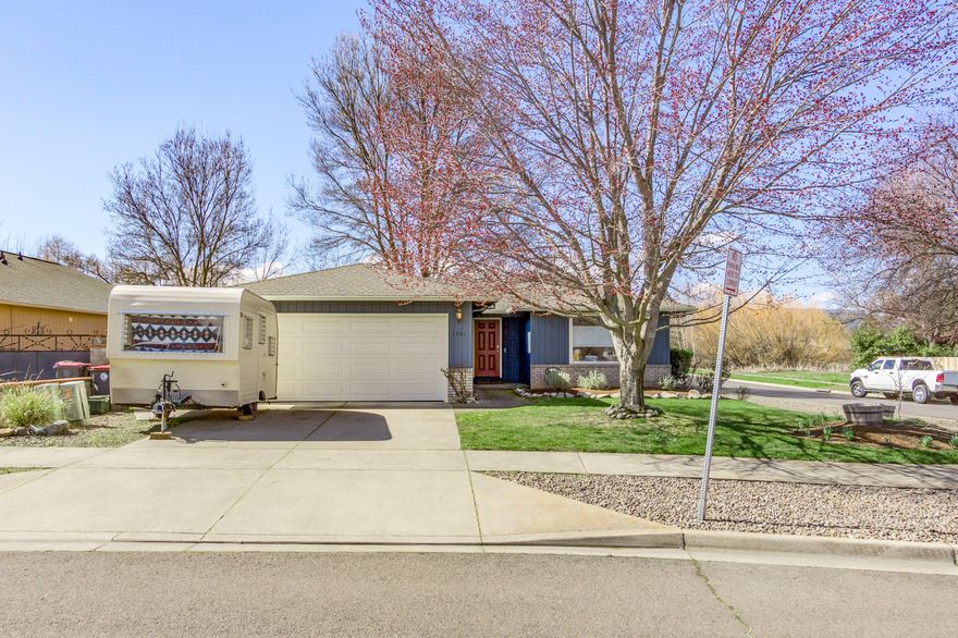 Move-in ready 3 bed / 2 bath on roomy corner lot! Attractively updated within the last few years with new exterior & interior paint, new flooring in both bathrooms, new laminate flooring in all bedrooms, stunning floating range hood above 5-burner gas stove, and raised garden beds. All appliances will be included in the sale! Inviting living room with gas fireplace, top down - bottom up shades, and views of Roxy Anne. Master suite w/walk in closet at back of home. Indoor laundry/mud room. Extra parking in front for small RV/boat/trailer & plenty of extra parking available on Arlington. All properties directly behind are designated wetlands & riparian corridor and undevelopable, leaving a wonderful buffer of space and lasting views of the scenic wildlife and surrounding mountains. Schedule your showing today!