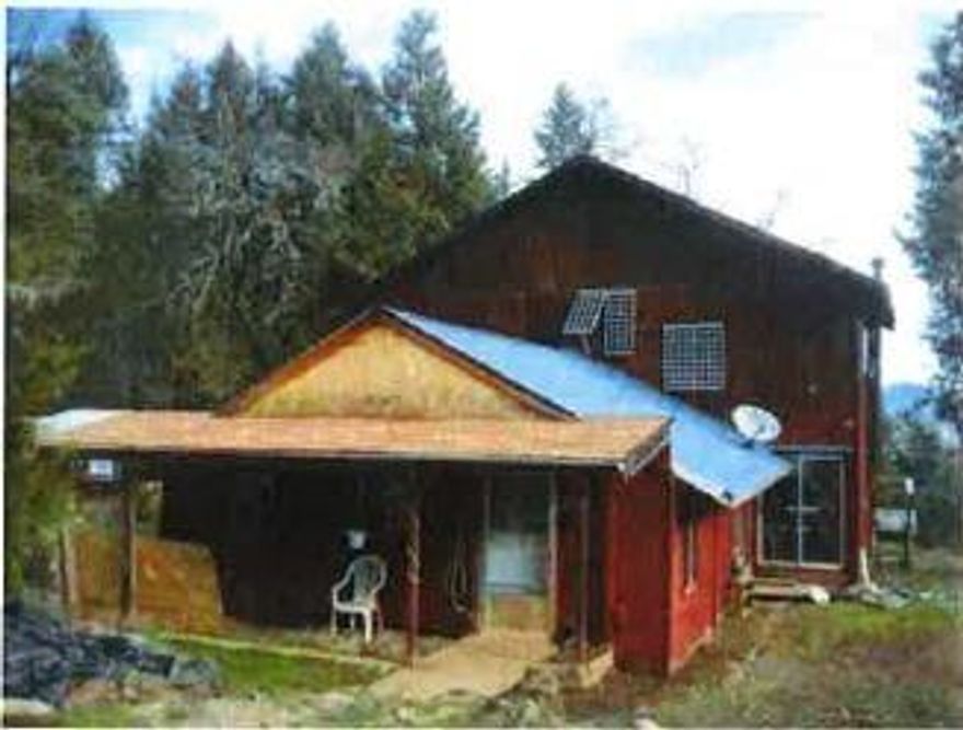 Amazing 160 acres of heavily wooded mountain terrain with amazing views overlooking Dick George Valley area. Remote and secluded allowing for serene privacy. BLM property provides access with private easement. The Chalet style home is warm and roomy, offering panoramic views of the valley below. Large Master bedroom takes up most of upper floor. This retreat has so much to offer either as a getaway or as a growers paradise. There are many areas that have small clearings for cultivating as well as marketable timber.