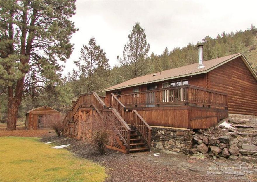 Cozy 2 bedroom,2 bath,1120 sqft,one level home with log style siding. Free standing wood burning stove. Mckenzie Canyon setting with 20 treed acres that adjoin public lands. Views of ponds, seasonal canal and Rimrock from the front deck. Well landscaped, sprinklers, retaining wall. Additional 12'x24' building framed and sided to match home makes a great guest quarters, hobby rm or storage area. Hard to find property just outside the historic town of Sisters. Come enjoy the wildlife and getaway from it all!