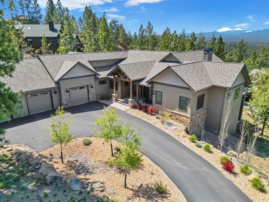 Luxury living in Awbrey Butte in this 4-year old single-level custom home, designed with 3 bedrooms, 2 private office spaces, an oversized sound-isolated audio/studio/bonus room, & a separate fitness room or flex space off the garage. Enjoy sweeping Cascade Mountain views from the living area & spacious primary suite, both enhanced by large windows & automated blinds. The chef's kitchen features an 8-burner Viking range, Sub-Zero refrigerator & freezer, quartz counters, & custom cabinetry, opening to a dining room with dry bar & dual wine fridges—perfect for entertaining. Hydronic radiant heated floors throughout add year-round comfort. The primary bathroom offers a spa-like retreat with stunning views. An oversized 3-car garage includes epoxy flooring & a versatile bonus room ideal for hobbies or gear storage, there's a 500 sq ft below-grade basement ideal for storage or projects. Every detail in this home was thoughtfully selected to offer comfort, style, & functionality.