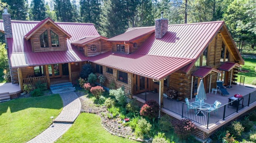 Forested Oregon setting! Feel the craftsmanship of this expanded and updated Homestead log home nicely situated on 18+/- acres in the woods. Attention to detail can be found throughout the home and property. The 3747 sq ft log home has 4 generously sized bedrooms and 4 baths (2 full/2 half). Enjoy nature and landscaped surroundings from the outdoor decks. Other notable features include expansive ceilings, a loft, a wood stove, a wood-burning fireplace, sun room, large covered porch, large windows throughout, back-up generator, two heat pumps, two security systems. The detached, two car garage has built in cabinets, space for additional storage and expansive loft. A fenced pasture overlooking the ornamental pond has a loafing shed and hay shed for two happy Llamas. The property adjoins 40 acres of BLM land and the gated entry provides added privacy.