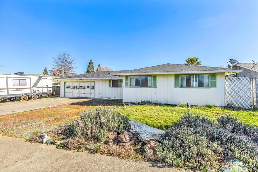 This diamond in the rough is waiting for you to make it shine!   This 3 bedroom 1.5 bathroom 1200 sq ft home is centrally located in Central Point close to schools and shopping.  The kitchen has been updated with new cabinets, countertops, flooring and stainless steel appliances and features a nice size island with breakfast nook.  The backyard is spacious and features a patio and pool and with some TLC would make a great place to relax and entertain.