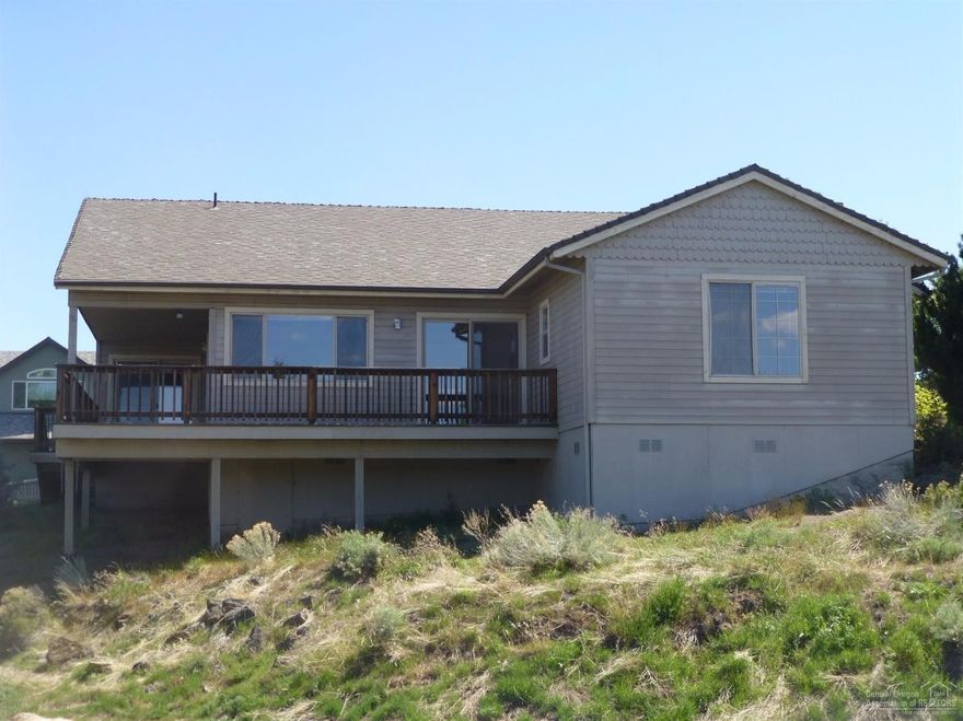 Great 3bd 2ba home in NE Bend on 1/2 Acre Corner Lot. House sits up on a hill with beautiful Cascade Mnt Views. Natural landscape with abundant wildlife. Great investors opportunity. Wood deck surrounds 2 sides of the house, great for relaxing or entertaining.