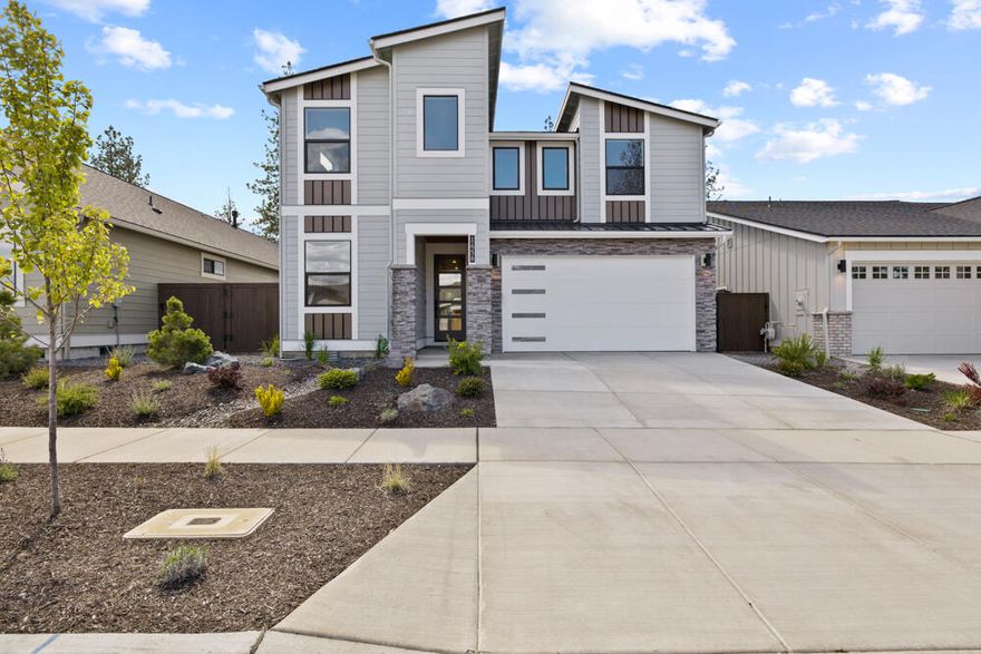 MOVE-IN READY! Home site 53, tucked beneath a canopy of Ponderosa Pines, is part of the signature Collier community by Pahlisch Homes. The Morgan floor plan boasts open, light-filled spaces and a stunning kitchen. Featuring four bedrooms, a spacious bonus room, and a dedicated office, it's perfect for a work-from-home lifestyle. High-end finishes include JennAir appliances (refrigerator too!), a tile walk-in shower, blinds, backyard landscape and engineered hardwood floors. Thoughtful upgrades like a floor-to-ceiling masonry fireplace surround, hardwood flooring in the office, window coverings and an electric vehicle charger in the garage add exceptional value. With most homes backing to green space, enjoy a tranquil, serene setting. Located less than a mile from Northwest Crossing's shops, restaurants, parks, and schools, you'll experience the best of northwest Bend. Plus, trails are just steps away, offering easy access to Mt. Bachelor and the Cascade lakes.