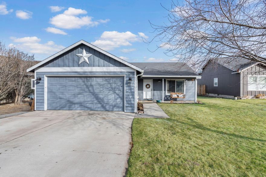 Craftsmanship throughout this like new home in Morning Crest Estates of NE Madras minutes from downtown! Spacious living both inside & out, w/plenty of room for entertaining. Vaulted Great Room plan w/living space that offers a cozy Gas burning fireplace w/stylish stacked stone + hearth/mantle. Beautiful laminate wood flooring throughout main living areas w/carpet in bedrooms! Open Kitchen, plenty of cabinetry & prep space, island w/breakfast bar seating, SS refrigerator & dining area w/sliding doors to lead outside. Well sized primary Bedroom w/natural light ftrs bath w/step-in shower + semi walk in closet. 2 additional guest rooms share a full bath or utilize a room as an office/den area! Laundry room w/built in shelving. Gas forced air, Central A/C, back patio, garden beds, plus small stoned area for a possible firepit? Bring your imagination. Double car garage, fully fenced, fully landscaped w/sprinklers. Don't miss your chance to live in this lightly lived in home in NW Madras!