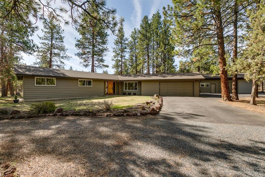 This beautiful home in a peaceful and private setting among the ponderosa and juniper trees is a perfect place to retreat from the hustle of daily life. This home has been lovingly upgraded with new floors, new bathrooms, new paint, Martha Stewart closet organizers in the master closet, and new roof in 2016. Detached shop with abundant storage and detached garage with 9 ft door that is ideal for your camper van or smaller RV. Relax in your Artic Spa hot tub while you listen to wind in the trees, or music from the Sonos sound system piped outside. Set up for horses with two 12 x 24 Noble loafing sheds, water/power, and a large area previously used as an outdoor riding area. All sorts of room for the gardener with raised beds for greens and a productive pumpkin patch. Beautiful 8 x 12 greenhouse for starts and tomatoes. Great NW location just 10 minutes from town and just minutes from Shevlin Park. Come fall in love!