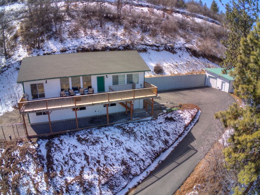 Views, Views, Views!!!  Immaculate 4 bedroom, 2 & 1/2 bathroom on 0.82 acres with views of Klamath Lake and the surrounding areas. Just minutes from downtown.  Enjoy the peace and quiet comfort of this beautiful hillside lot.  Backyard access to scenic Klamath Ridge View Trail and Moore Park Trail system.  Large east to west deck flanks the front of the home, providing ample entertaining area.  Updates throughout include fresh paint, custom blinds, and lots more.  Detached shop provides 960 sq. ft. of additional storage.