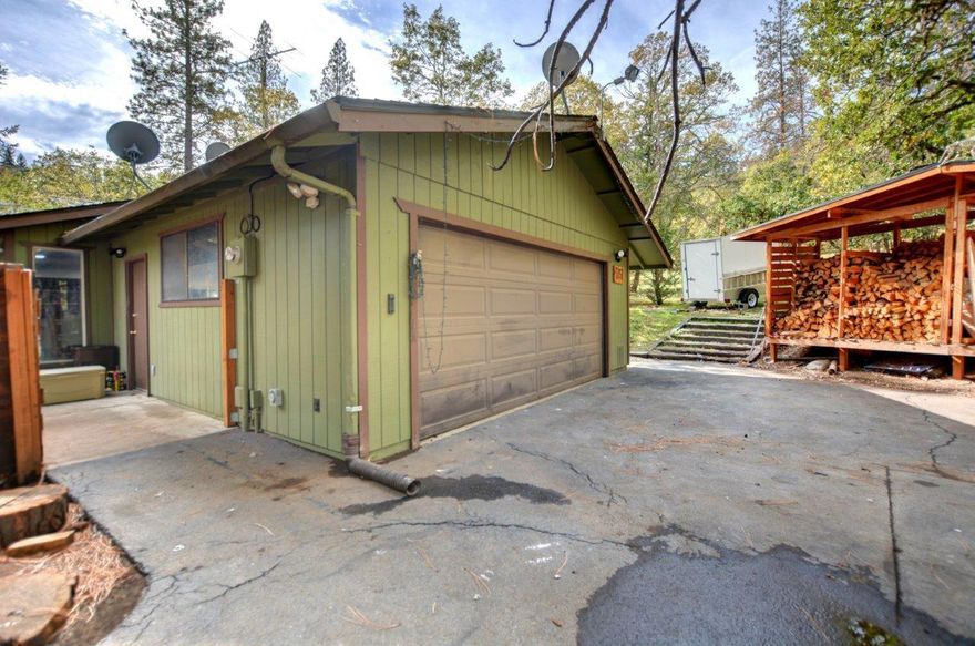 Looking for a Rural property close to town? Here it is! Space here to enjoy and make it your own! 1.91-acre property hard to find. Circle driveway with plenty of parking in front of a 2-car garage. Single level home is 1300sq ft with 3 bedrooms and 2 full bathrooms. Has a master bedroom with own bathroom and 2 spare bedrooms. Open floor plan with living room, dining room, and kitchen. Sliding door that opens to covered back patio and large back yard which is partially fenced for owners' goats, chickens and dogs. Outdoor patio designed for entertaining guests. Shed doubles as storage and barn for animals. Home has new floors, new appliances all within last 5 years, and kitchen and main bathroom have been remodeled with granite and marble. Come see this property today and everything it has to offer. Schedule a showing now!