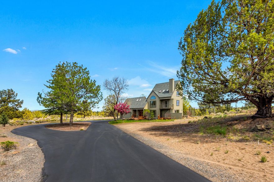 Unique opportunity to own an artistic estate in Lane Knolls! This home is an architectural delight for the perfect buyer who will appreciate the eclectic design. The large picture windows capture beautiful light and views from every level. Main level great-room with open kitchen and propane fireplace. The second floor has a warm and inviting family room with built-in shelving, a bedroom, bath and loft. Generous main bedroom on the third floor with walk-in closet and large bathroom. Many of the original quality features of this two-bedroom 1990's home still exist such as the solid Oak hardwood floors, wood-wrapped windows, and built-in storage. Two-car garage with plenty of room to add on if you so desire. Nearly three private acres with plenty of acres of room to roam. Recently painted exterior. Newer roof. New recirculating water heater. Lots of opportunity for beautiful landscaping. Enjoy the serenity of Lane Knolls Estates with twinkling stars at night and lovely trails throughout.