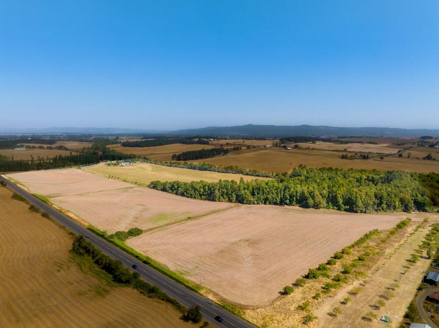 Peaceful country setting on 86.60 acres! The property is versatile and includes pasture, a pond, approximately 60 acres of grass seed, and 3.5 acres of Walnut Trees. The 1,514 sqft split-level home features 3 beds, 2 baths, vaulted ceilings, and an open floor plan. Multiple outbuildings with power, including 5082 sqft silo, 1404 sqft 2-sided machine shed, 900 sqft shop, and 936 sqft shop. Must see!