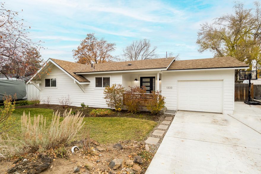 Located on a spacious fenced and landscaped lot, this beautifully updated home combines quiet neighborhood charm with an excellent Midtown location. The interior is light and bright, with warm white oak LVP flooring throughout. Southern exposure floods the living room with light throughout the day thanks to the large sliding door that opens to an expansive back deck with pergola and generous back yard. Stylish and functional with abundant storage space, the kitchen features quartz countertops, white subway tile backsplash, updated cabinetry, and a single-bowl granite undermount sink. In the primary suite, a walk-in closet with organizers complements an updated bath with double vanity, tiled counters, and linen closet.  Additional features include an energy-efficient heat pump with ductless mini split and a brand new roof, being installed Nov 2025. Located in a quiet neighborhood steps from Stover Park and Hollinshead Park - with its off-leash dog park - listing broker is also owner.