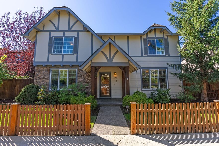 Loaded with designer touches and sought after floor plan features, this exceptional home is located in Stonehaven in Bend's thriving SE section. With four bedrooms, including two primary suites, an office and a bonus room, this home offers incredible flexibility. Graced with classic architectural and design elements including plentiful built-ins, leaded accent windows, wood bannister and crisp white accent paint, this home also features updated quartz counters, tile backsplash and tile fireplace surround. On the upper level, in addition to the second primary suite and two additional bedrooms, you'll find a large bonus room with a convenient wet bar and a dedicated office space with work counter and abundant storage. The fully fenced backyard includes a soothing water feature and an expansive patio with a large covered section, perfect for outdoor meals and summer gatherings. Stonehaven is a quiet, established neighborhood with easy access to nearby golf courses, schools and parks.