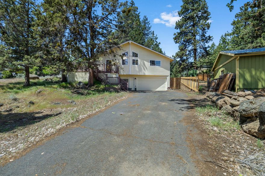 Nice and tidy home in the west hills set above Portland Ave. Less than a quarter mile to Newport Ave with dining, shopping and entertainment. Only a mile to downtown Bend. Urban entertainment readily available on a mature lot with privacy and easy access to all the city has to offer.  This home lives larger with vaulted wood ceilings and loads of natural light from the abundant windows providing views of the plentiful trees, .Newly remodeled master bathroom and a large lot with peaceful outdoor space and plenty of room. Development potential, Buyer to do due diligence with the city of Bend,