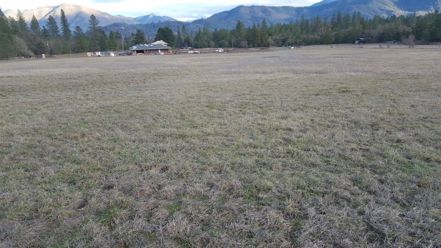 This open, irrigated 5 acre parcel can be sold separately or together with the neighboring 5.7 acre property with a 2600 plus square foot home next door. It has been used in the past to grow crops but would make a nice spot for a new home with plenty of room for critters and gardens. Please refer to MLS #2961460 for information on the property next door. Irrigation rights go with this property off Upper Powell Creek.