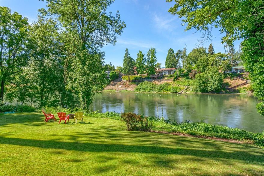 You sit down in your back yard and watch the waters go by. You own a piece of the World Famous Rogue River and river's edge is just a few steps away. You launch your drift boat and drift down the river with either a margarita or a fishing pole in your hands...maybe both. The area is serene and lush with vegetation...ducks and geese float by on the water. You walk up to your deck, turn on the grill and enjoy a summer barbecue being immersed in the beautiful surroundings. Your new home has that perfect cabin feel you expect for a Southern Oregon river home. The living room is spacious with amazing views. The master bedroom is comfortable and roomy...plenty of room for your king bed and dressers. Your home was designed that almost every room can view the river. Your front yard is gives you the privacy you've always wanted...and the zoning will allow you to build a guest house. It has that perfect park-like feel. But then you woke up and realized you haven't made this home yours yet!