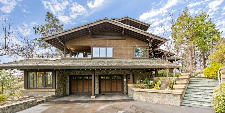 Switzerland in Ashland. This amazing Craftsman home sits on a point with views of  Mt. Shasta, Mt Ashland and the Siskiyou mountains including Pilot Rock. Living amongst nature with double doors in the living room that open to the slate patio & a pond which doubles as a water feature. Entry is slate leading to the Cherry wood floors in the great room and kitchen.  Gracious open floor plan, a wall of windows for light & terrific views & a wall of bookshelves. Gourmet kitchen features a soap stone pizza oven, Aga stove, sub-Zero refrigerator and tons of cabinets & pantry. Downstairs has high ceilings, open wooden beams and an office with a Tulikivi stove and an enclosed  porch. A  Upstairs is all master wing featuring a vaulted ceiling with exposed wooden beams, a fireplace & 2 separate master bathrooms. Two secondary bedrooms are on the main floor.  The 2nd home is 1350 sf on a 40+ acre tax lot which includes a  3 car garage/ workshop, tennis court and a garden area with raised beds.