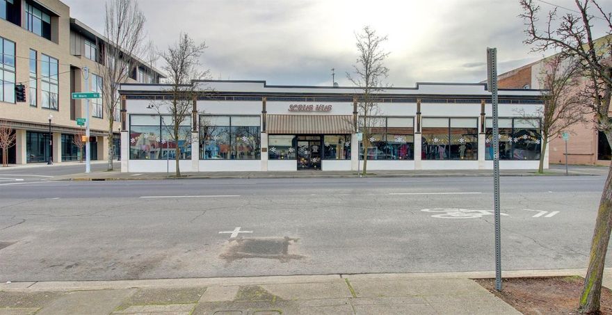 Premiere downtown location. Corner lot with additional access along Fir St. which may allow for up to 1100 square feet of separate retail space (buyer due diligence required). Well cared for historical building features beautiful exposed brick walls and recent updates such as replacement of two HVAC systems in 2014, new exterior paint in 2017, and new reflective window tint. Currently home to Scrub Hub, a thriving local business, this 7000 square foot building is an opportunity for investors looking to secure a building with a strong tenant in place. Attractive three year lease with three year option for renewal to be included in sale.