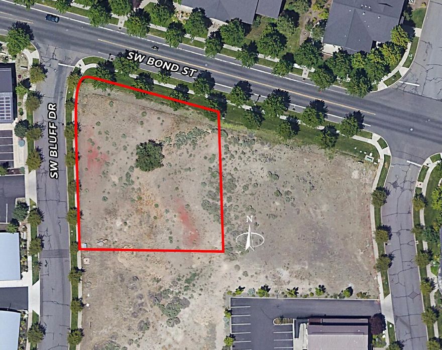 Exceptional mixed-use development opportunity in the heart of Bend's vibrant Old Mill District. This 0.54-acre parcel is zoned Mixed-Use Riverfront (MR), allowing for retail, restaurant, multifamily, hospitality, or office uses. Land use approvals are already in place for a nine-unit townhome project (conceptual renderings available), streamlining development timelines. The site is graded and retaining walls have been completed, with utilities ready for service, offering a true shovel-ready opportunity. The property's corner location provides mountain and river views, with high visibility and excellent access from SW Bond Street and SW Bluff Drive. Located in an Opportunity Zone, the property is suitable for outright sale or joint venture.