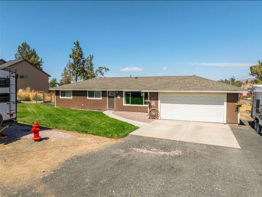 This is a complete upgraded home with almost one acre of space with enough room for all your toys. Within 5 minutes to Redmond, a couple of minutes away from the Terrebonne store, this home has it all for you.  With three bedrooms, two bathrooms plus a bonus room. It has a new woodstove to keep you nice and toasty, it also has electric heat and a mini split as backup. The kitchen is newly remodeled with new appliances, new lighting and new water heater and new fans to circulate the air through your home for comfort.  There is plenty of room for a garden and your chickens. The sellers just painted the outside.  Someone is going to get an awesome deal. Also sellers will pay for one year home warranty up to $700 at close of Escrow for the new buyers.