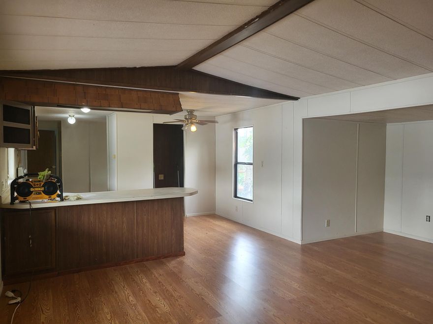 1991, 2bd, 2ba, open floor plan, laundry rm, laminate floors, vaulted ceilings, and primary bd rm with ensuite.  There is parking with storage, large yard and the home has a  6 month-old comp roof !!  Convenient location off Central Ave in Sutherlin.  Soft Winds Mobile Park for all ages.  #9