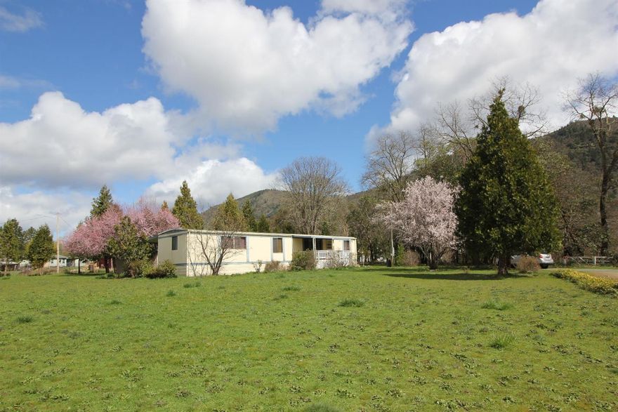 Springtime native wildflowers and a woodland setting of cedars, oaks & madrones on 1.03 acres. Property has been loved and well cared for in the same family 40+ years, per seller. 2 bedroom, 2 bath. Carport extends the length of the home, handicap accessible and room for a garden. Approx. 270 sq.ft. outbuilding/workshop. Front porch to relax and enjoy the scenic beauty of the land. Seller may consider owner-carry with acceptable credit and down payment. Information deemed accurate but not guaranteed by seller or listing agent. Buyer to do own due diligence on said property for desired use.