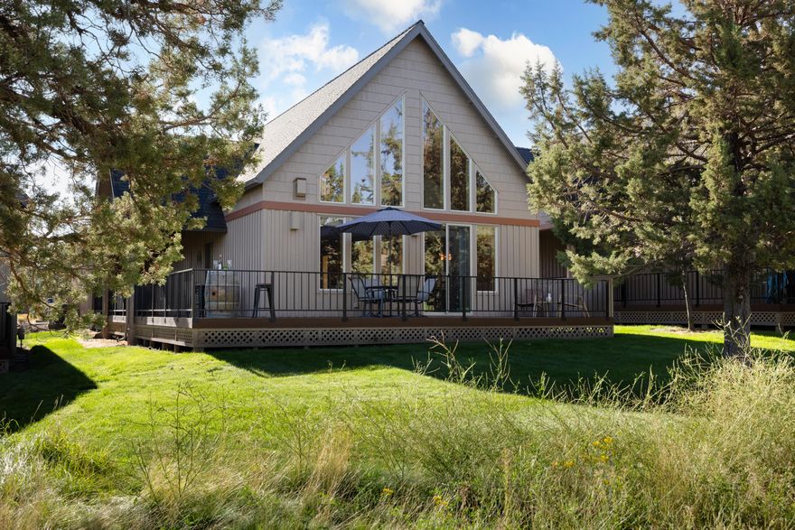 Welcome to your Eagle Crest escape! Overlooking the 18th fairway of the Ridge Course, this furnished chalet combines comfort, style, and resort living. The open floor plan with loft creates a bright and airy feel, while expansive windows capture sweeping golf course and sunset views. Gather around the stunning floor-to-ceiling stone fireplace after a day of adventure, or entertain from the kitchen with granite counters, breakfast nook, and large pantry. Recent updates include all new main-level flooring, a new Trex deck, and a heat pump for year-round comfort. With a rare 2-car garage and furnishings included, this home is truly turn-key. Owners and guests enjoy pools, pickleball, tennis, spa, gym, miles of trails, and three golf courses! All just steps away. Eligible for short-term rental use, this chalet offers the perfect blend of vacation retreat, investment property, or full-time residence.