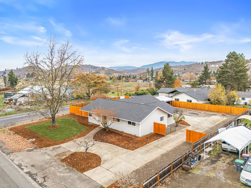 Move in Ready & recently remodeled w/ lots of upgrades in Griffin Creek School District! This
light & bright home offers 3 large bedrooms & 2 full baths with tile showers. Large family room
with newer efficient pellet stove. New roof & electrical panel in 2024! Home features vaulted
T&G wood ceilings in the family room and has a separate living room. Spacious kitchen with
beautiful white cabinets, granite counter tops & stainless appliances. Great size laundry room
that has ample space for additional storage. This home sits on a private .34-acre lot in
Southwest Medford w/ a two car garage & an oversized carport! There's plenty of space to park
an RV, a boat or any other toys! Country feel & yet close to town. New landscaping and ready
for new owners!