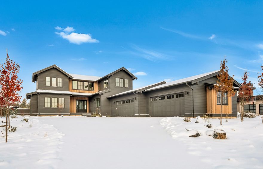 Captivating Mountain Farmhouse in Tetherow brought to you by the award-winning duo of Greg Welch Construction and Jason Todd Designs. Covered front entry leads to a welcoming foyer and great room with 12' ceilings and custom built-ins. Grand kitchen with quartz countertops, exquisite appliance package and lots of storage. Adjacent to the kitchen is a prep sink, wine refrigerator and expansive pantry. Large dining/sitting area off the kitchen with direct access to the rear paver patio, complete with a protected/covered portion and large gathering area around the fire pit. Private, main level resident suite along with study/den is separated from the secondary main level guest suite. Upstairs features two additional guest rooms, flex space and additional bonus room. Topped off with dual mechanical systems, extra storage and an expansive four car garage with epoxy floor.