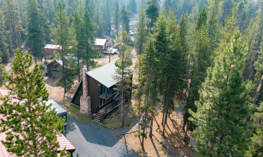 Check out this unique two-story retreat with Creekside views and access to endless trails. It combines vintage charm with modern touches in an 882 sq ft retro-style cabin from the 70s, tucked at the end of the road to create a friendly community feel. There's an extra 182 sq ft bonus room in the garage—great for guests or a cozy hangout. The cabin has all new appliances and a new Heat & Glow propane fireplace. Large vinyl windows offer beautiful views, and the upstairs balcony is perfect for morning coffee or relaxing after a long day. Just outside, you can sit by the water or try your luck fishing in the creek that runs by the property. A 12x24 boat cover keeps your water gear protected, and a 16x12 shop gives you space for your land toys. Located next to USFS land, you have direct access to 1000's of trails, go hiking, mushroom picking, 4-wheeling, or exploring nearby Odell n Crescent Lake. It's just 15 minutes from Willamette Pass Ski Resort. Offered furnished! Move in ready!