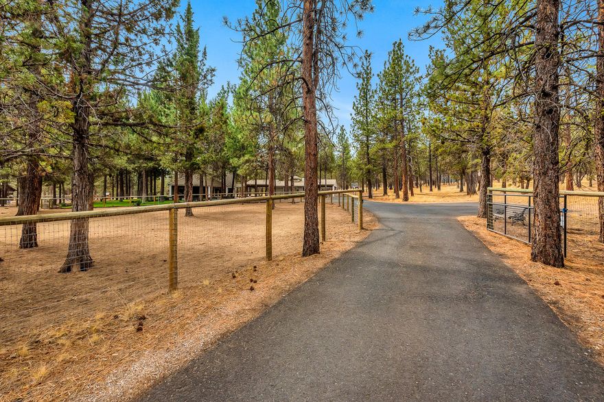 Beautiful turn key horse farm in NW Bend. This quiet, peaceful setting on 5 pine treed acres is minutes to Shevlin Park, Tumalo Creek, west side schools, shopping, trails and Downtown Bend. Fully fenced and cross fenced with an arena, 30x30 hay, equipment storage barn and a tack/feed barn with run in shed. This property is low maintenance for it's size and has an incredible setting with lush landscaping and an inviting large covered front porch with 1800 sq. ft. of wrap around decking. Inside you will find character and charm throughout, including large windows, vaulted ceilings, stainless steel appliances, warm wood floors open floor plan and large multi-purpose gathering room. The garage complex is attached to the house by breezeway. 2 car garage , shop, storage and two carport areas totaling 850 sq. ft. . Circular driveway with lots of parking. RV parking and hook up. The potential is limitless with this well kept, close in horse property.