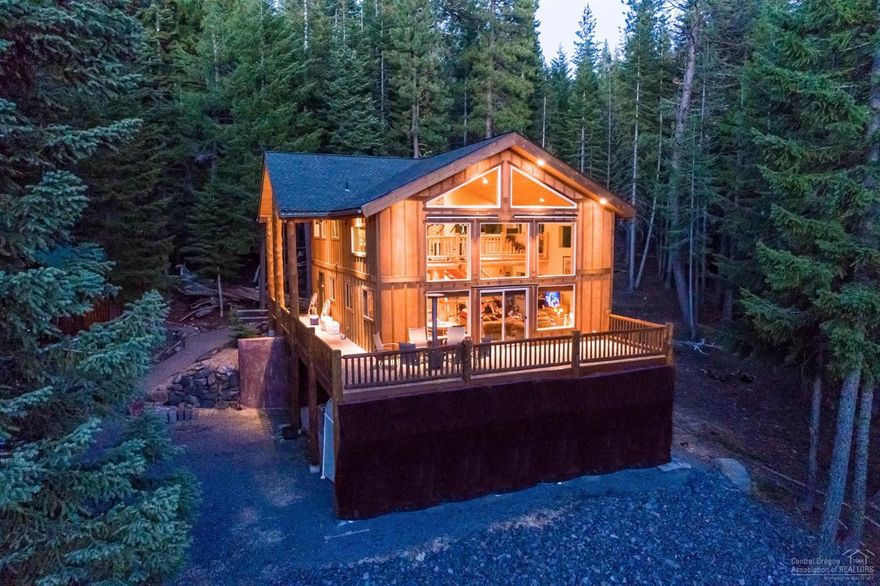 Minutes to Crescent Lake. Lrg cabin w/ two additional smaller one bedroom cabins backing to miles & miles of National forest land. The ultimate compound for family/friends.Lovingly maintained and cared for. Generous wood accents throughout. Downstairs media room w/ wet bar can easily be made into an add. bedroom. Large deck w/ views of Diamond Peak. Enjoy the forest & relax on the large wrap around deck. Fish, bike,snowmobile, ski, hike from cabin. Enjoy Crescent Lake, fly fishing & downhill skiing