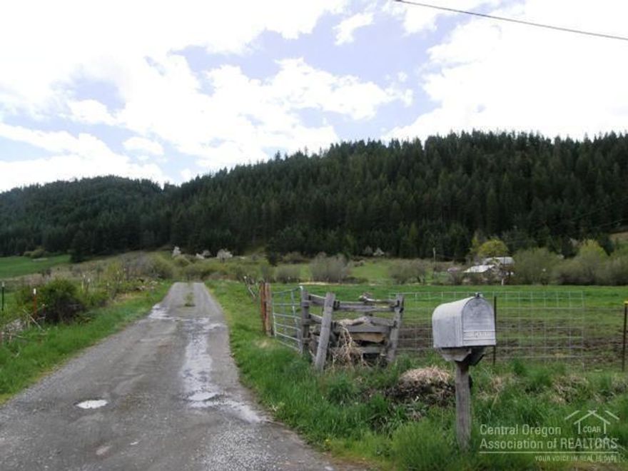Looking for that perfect property with a view, pasture, and timber - here it is. This 78.35 ac property has approx. 13 +/- acres in pasture in the 2 acre zone. Views abound from numerous potential building sites. Elk has been seen on property as well as turkey, deer, and numerous birds. Utilities already to an old home site including septic, electricity and phone, seller will not guarantee working utilities , spring has been used for household use. House on lane is not a part of the sale.