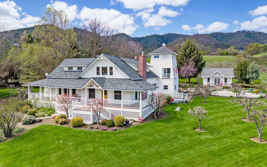 Nestled on 13 lush, irrigated acres, this stunning property showcases a meticulously restored 4 BD, 3.5 BA home from the turn of the century. Craftsmanship shines throughout, from wrap-around porches to Pozzi wooden double pane windows, fir hardwood floors, and a serene main-level primary bedroom with a luxurious ensuite. The living/dining area charms with 9-foot ceilings, a fireplace, and ample windows, while a peaceful library/den offers a quiet retreat. The gourmet kitchen features a Viking range, Sub Zero refrigerator, and a charming breakfast nook/family area. Upstairs, find 3 bedrooms including a loft BD with knotty pine walls. Outside, enjoy fruit trees, gardens, a stall barn, and a detached 369 sqft pool house with full bath, sauna and wet bar—a perfect entertainment area. Don't miss this rare opportunity!