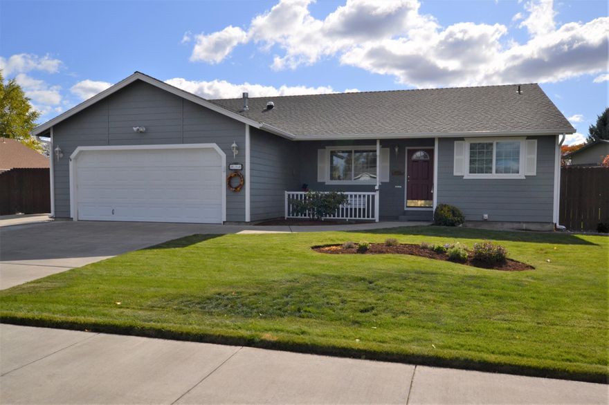 Immaculate single level home in NW Redmond with RV parking and full hookups! This wonderfully maintained home has 3 bedrooms, 2 bathrooms and a very spacious living room with gas fireplace and vaulted ceilings. The kitchen is light and bright with breakfast bar and plenty of cabinet space. Enjoy laminate flooring throughout the home for easy cleaning. The master is separated from the guest bedrooms and features a walk-in closet and double vanity in the attached master bath. There is a large laundry room with solar tube light. There is natural gas forced air with AC and a new water heater. Outside there is gated RV parking with full hookups, storage shed and a covered patio with sun screen. Beautifully landscaped with sprinklers and a fully fenced backyard. Minutes away from shopping, medical and Downtown Redmond!